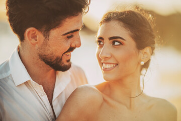 Wedding beach young couple sunset sand white happy sea waves