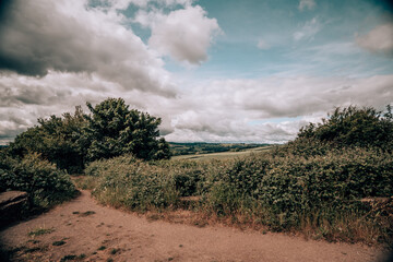 English countryside landscape beautiful sky clouds and green grass and trees