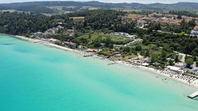 Aerial footage from waterfront to the most popular village in Halkidiki- Kallithea. It is located in the first peninsula of Halkidiki, Kassandra.