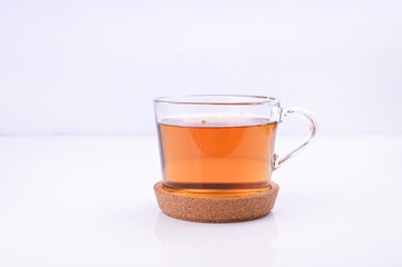 Jasmine tea in a glass cup on a white background. Aromatherapy and Ayurvedic herbs. Healthcare concept