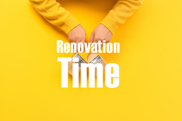 renovation time  inscription over paint brush, concept of apartment repair and painting works
