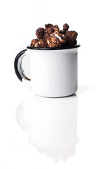 Rustic colored cups of Chocolate, Strawberry and Cream Gourmet Popcorn over white background.