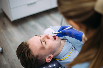 Young boy at the dentist consultation. Checking and dental treatment in a clinic