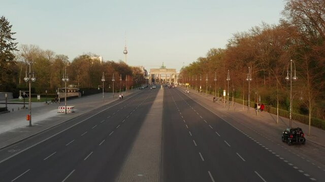 AERIAL: Empty Brandenburger Tor in Berlin, Germany due to Coronavirus COVID 19 Pandemic in Sunset Light