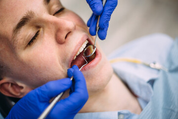 Fototapeta premium Boy at the dentist consultation. Checking and dental treatment in a clinic.