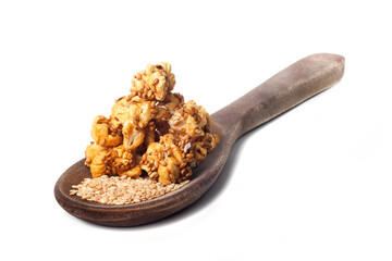 Side view of gourmet sesame seed popcorn over white background.