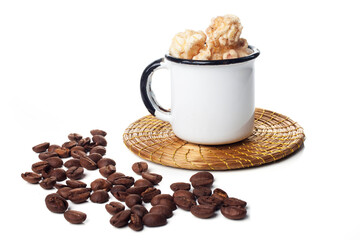 Amazing view of gourmet cinnamon and coffee popcorn with rustic utensils over a white background.