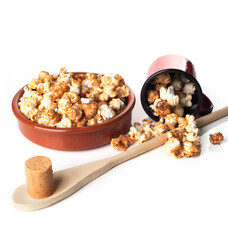 Rustic bowls with gourmet peanut candy popcorn isolated on white background.