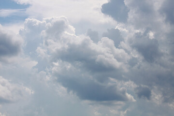 Light cumulus white clouds on a blue sky at daylight