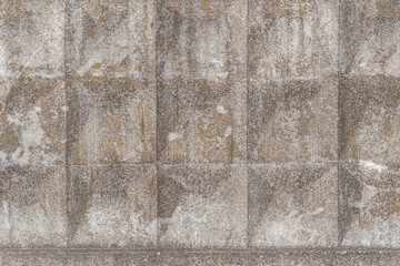 vintage background of an old concrete wall with relief volume pattern