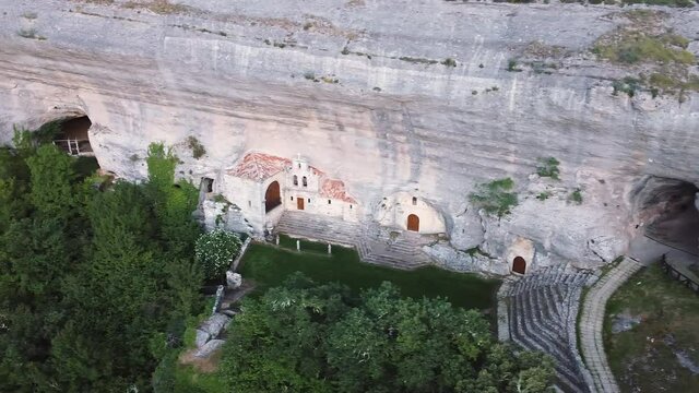 Aerial view of Saint Bernabe Ancient Heremitage in a cave in Ojo Guarena, Burgos, Spain. High quality 4k footage