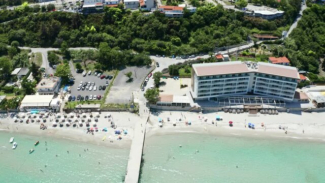 Aerial tilt footage from waterfront to the most popular village in Halkidiki- Kallithea. It is located in the first peninsula of Halkidiki, Kassandra.
