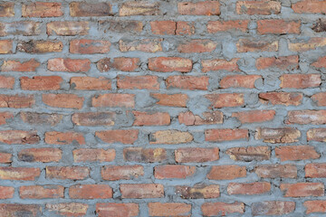 Obraz premium Closeup of weathered brick wall texture