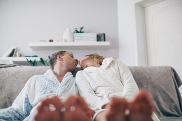 man and woman posing sofa. Couple in love. Love game. Kissing. Kiss. Sensual. Home photo. 