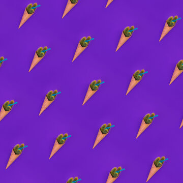 Seamless diagonal pattern with fake ice cream. Trendy Waffle cone with green cacus with sharp yellow needles and plastic spoon on bright violet background, Creative concept. Dangerous food. Top view