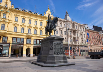Fototapeta na wymiar Zagreb, Croatia-April 15th, 2020: Statue of famous croatian general, towering on the horse above Zagreb`s main square, empty during corona virus epidemic and after earthquake damaged the city