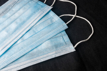 Background concept for news about the novel coronavirus COVID-19 pandemic, antiviral medical mask...
