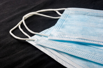Background concept for news about the novel coronavirus COVID-19 pandemic, antiviral medical mask...