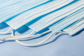 Background concept for news about the novel coronavirus COVID-19 pandemic, antiviral medical mask for protection against coronavirus. Surgical protective mask. Medical respiratory