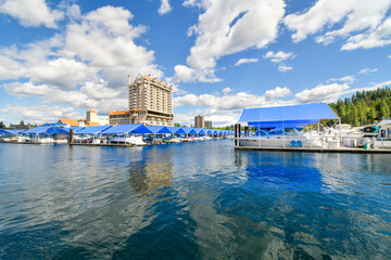 A view from the floating boardwalk of the marina full with boats and the Coeur d'Alene Resort on...