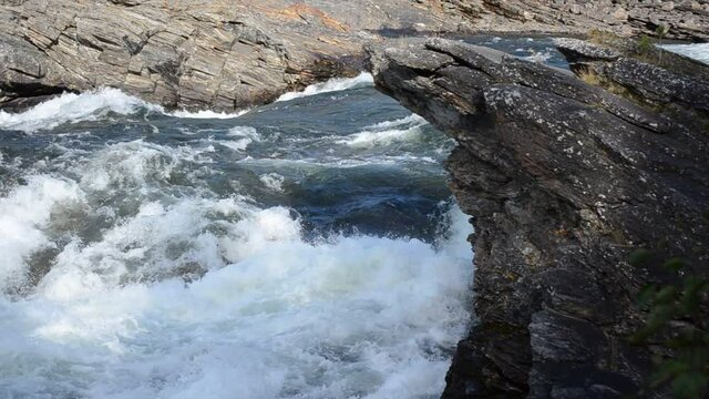 fast flowing river in autumn