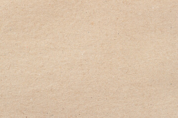 Craft paper texture cardboard background close-up. Grunge old paper surface