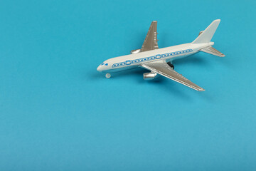toy air plane on blue background top view with copy space
