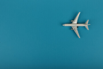 Naklejka na ściany i meble toy air plane on blue background top view with copy space
