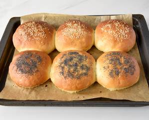 hot homemade buns with sesame and poppy seeds
