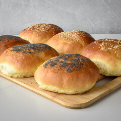 hot homemade buns with sesame and poppy seeds