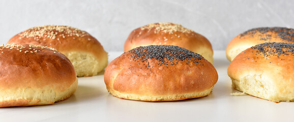 hot homemade buns with sesame and poppy seeds