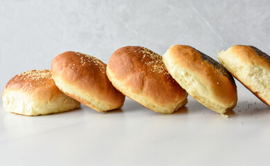 hot homemade buns with sesame and poppy seeds