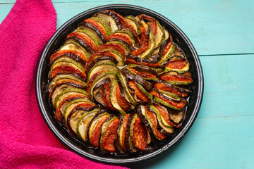 French baked ratatouille on turquoise background