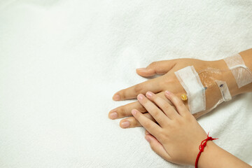hand in hand, kid holding hand of old patient in hospital for Encouragement and concern.