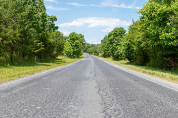 Fototapeta na wymiar A treelined country road near rural Poolesviile, Montgomery County, Maryland.