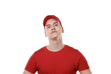 Portrait of a young guy from a delivery service. Red uniform.