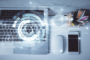Multi exposure of data drawing hologram over topview of study desk background with computer. Concept of technology.