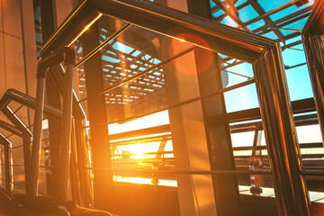 The sun shines through the airport window,the blue sky is visible through the transparent glass, a...