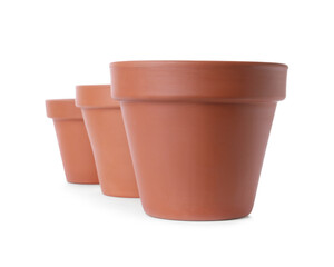 Stylish terracotta flower pots isolated on white