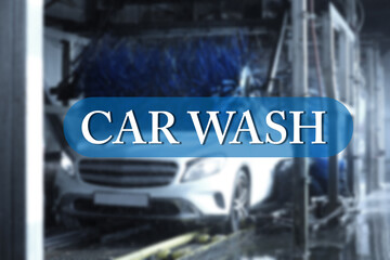 Text Car Wash and modern automobile undergoing cleaning on background