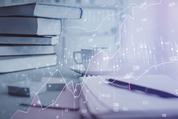 Double exposure of financial chart drawing and desktop with coffee and items on table background....