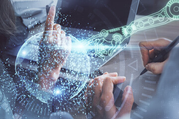 Double exposure of man and woman working together and technology theme drawing hologram. Big data concept. Computer background.