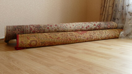 floor carpets are rolled up