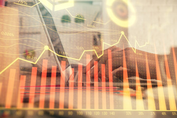 Double exposure of woman hands typing on computer and forex chart hologram drawing. Stock market invest concept.