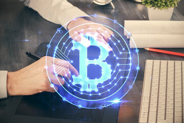 Double exposure of man's hands holding and using a phone and crypto currency blockchain theme drawing.
