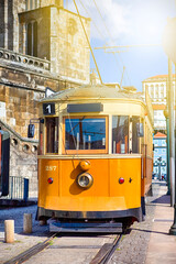 Naklejka na ściany i meble Portugese Travel Destinations. Traditional Porto Yellow Tram on Streets in Portugal.