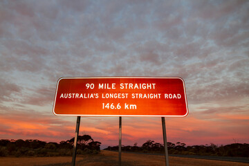The signpost at the 90 mile straight, Balladonia, Western Australia at sunset. 