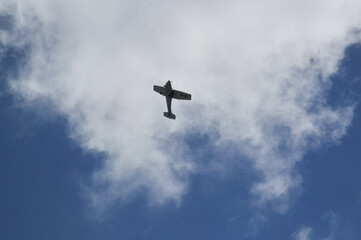 propeller plane flying around the neighbourhood practicing in the morning. 