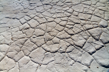 Cracked earth, sand and limestone, Australia