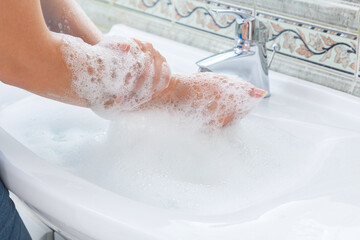 Woman washing hands close-up